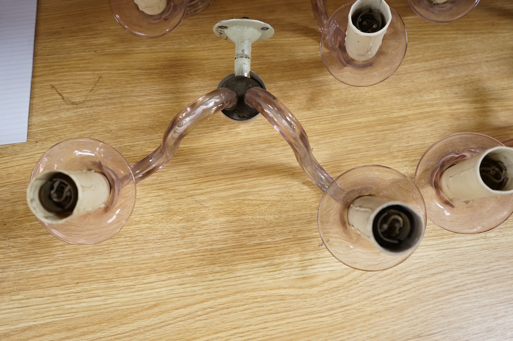 A set of four, two branch, pink glass wall lights, 25cm deep